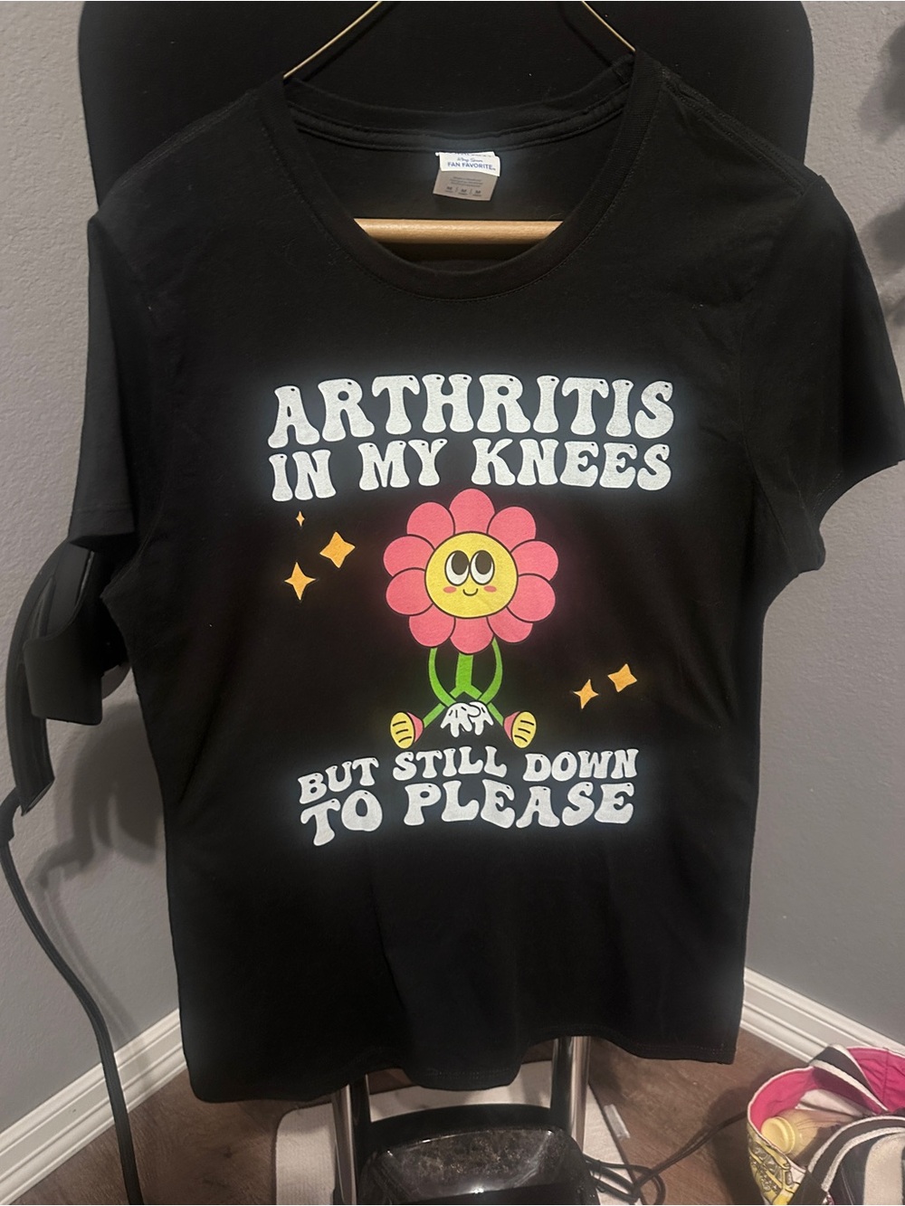 Women's Black Graphic Tee — 'Arthritis In My Knees' Smiley Flower